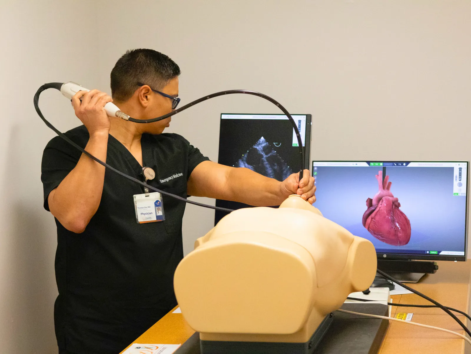 Faculty practicing resuscitative TEE on the HeartWorks simulator
