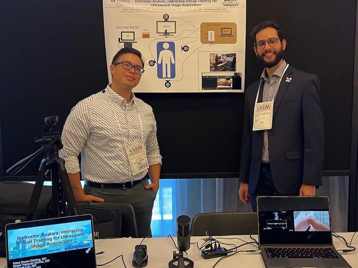 Faculty presenting an ultrasound research project at SAEM