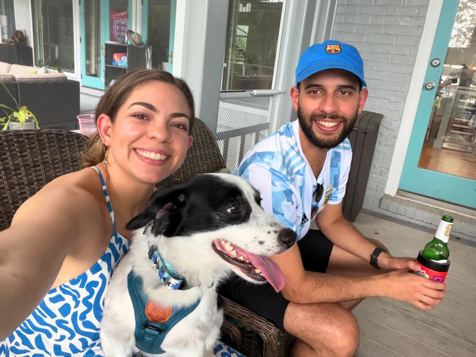 Friends hanging out on a Riverside front porch with a dog